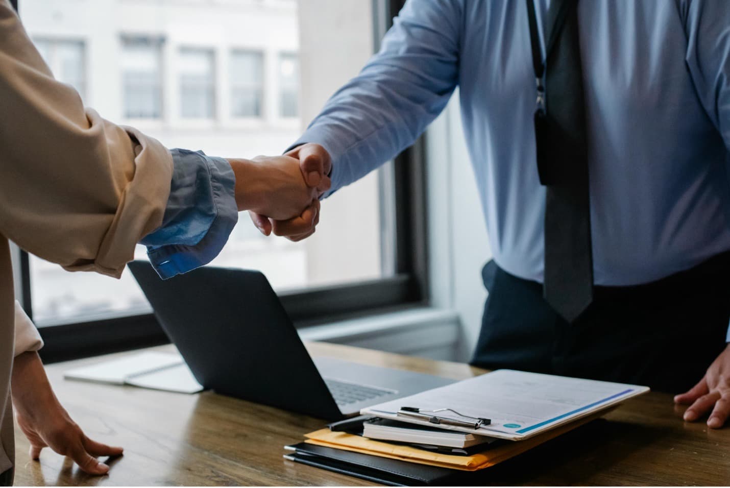 Professional handshake representing partnership and trust in healthcare